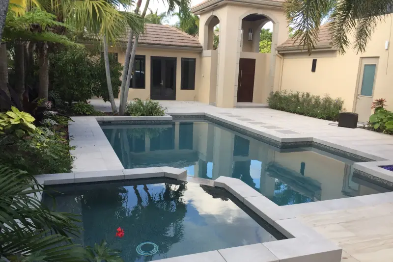 Geometric pool and spa in a courtyard