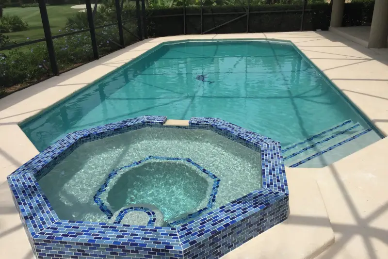 Octagonal spa with blue mosaic tile