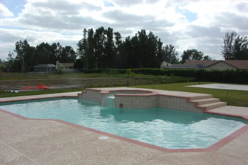 Freeform pool on a lakefront lot