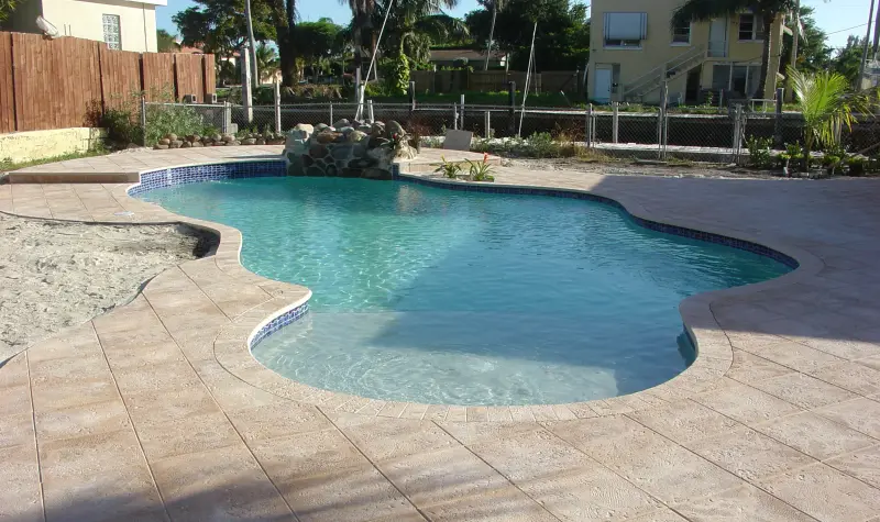 Freeform pool with a paver deck