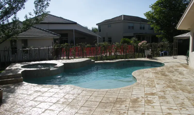 Freeform pool with raised spa