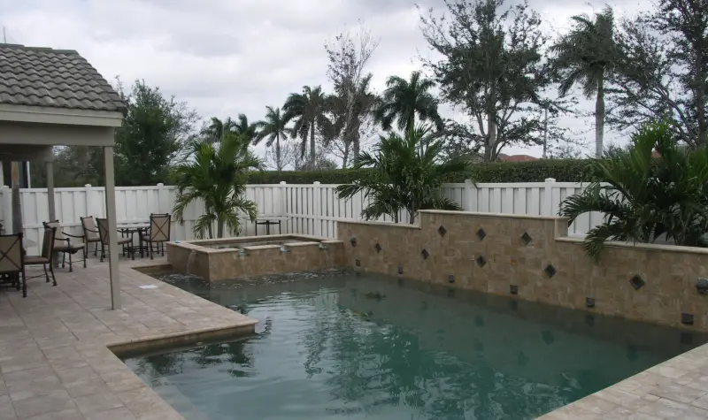 Pool with a stone wall water feature